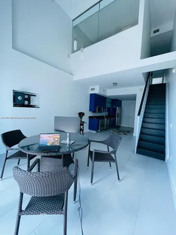 a work room with furniture and wooden floor