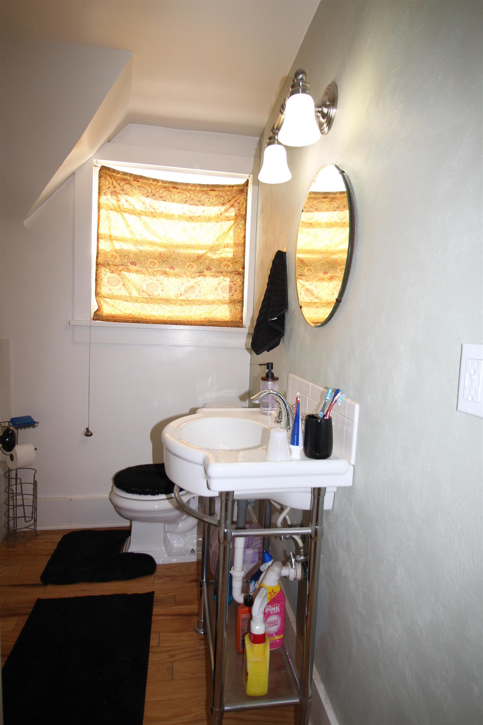 1150 East 7th Street Delta, CO 81416 - Photo 20 of 32 a bathroom with a sink and a mirror