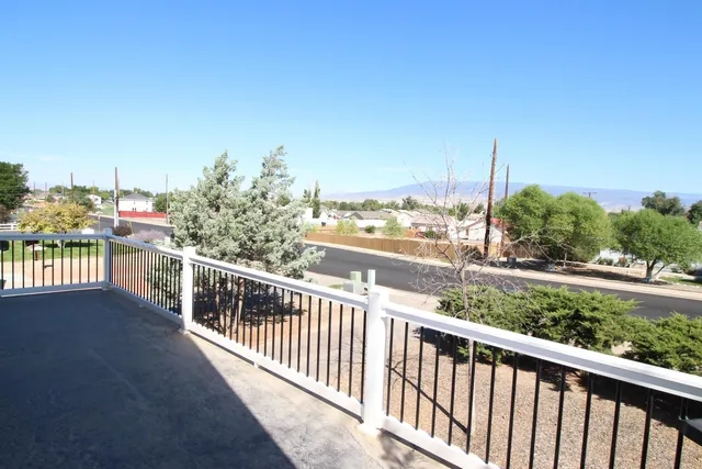 a view of a balcony with city view