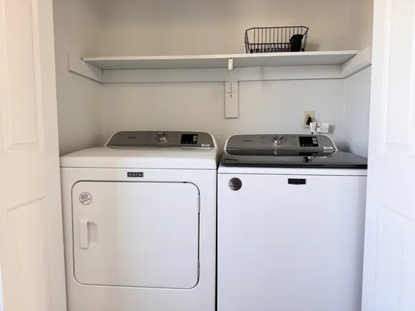 a utility room with dryer and washer