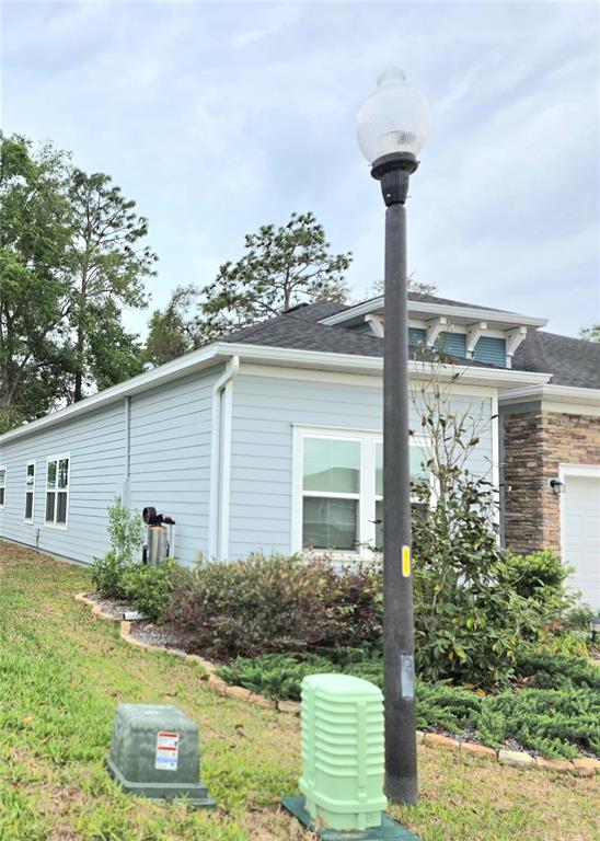 7875 Southwest 74th Street Ocala, FL 34474 - Photo 6 of 28 a front view of a house with garden