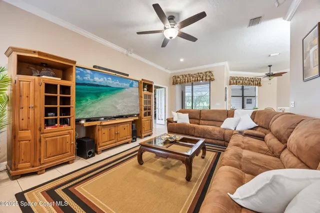 a view of a dining room with furniture wooden floor and chandelier