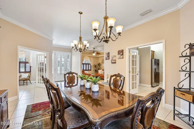 a living room with furniture a ceiling fan and a rug