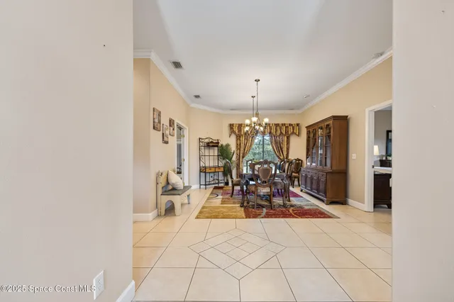 a spacious bedroom with a bed and dresser