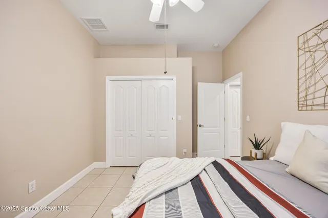 a view of a patio with a table and chairs and potted plants