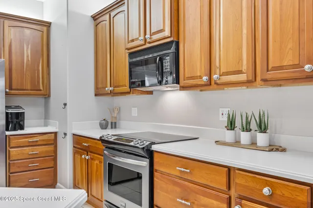 a kitchen with stainless steel appliances granite countertop a sink and cabinets