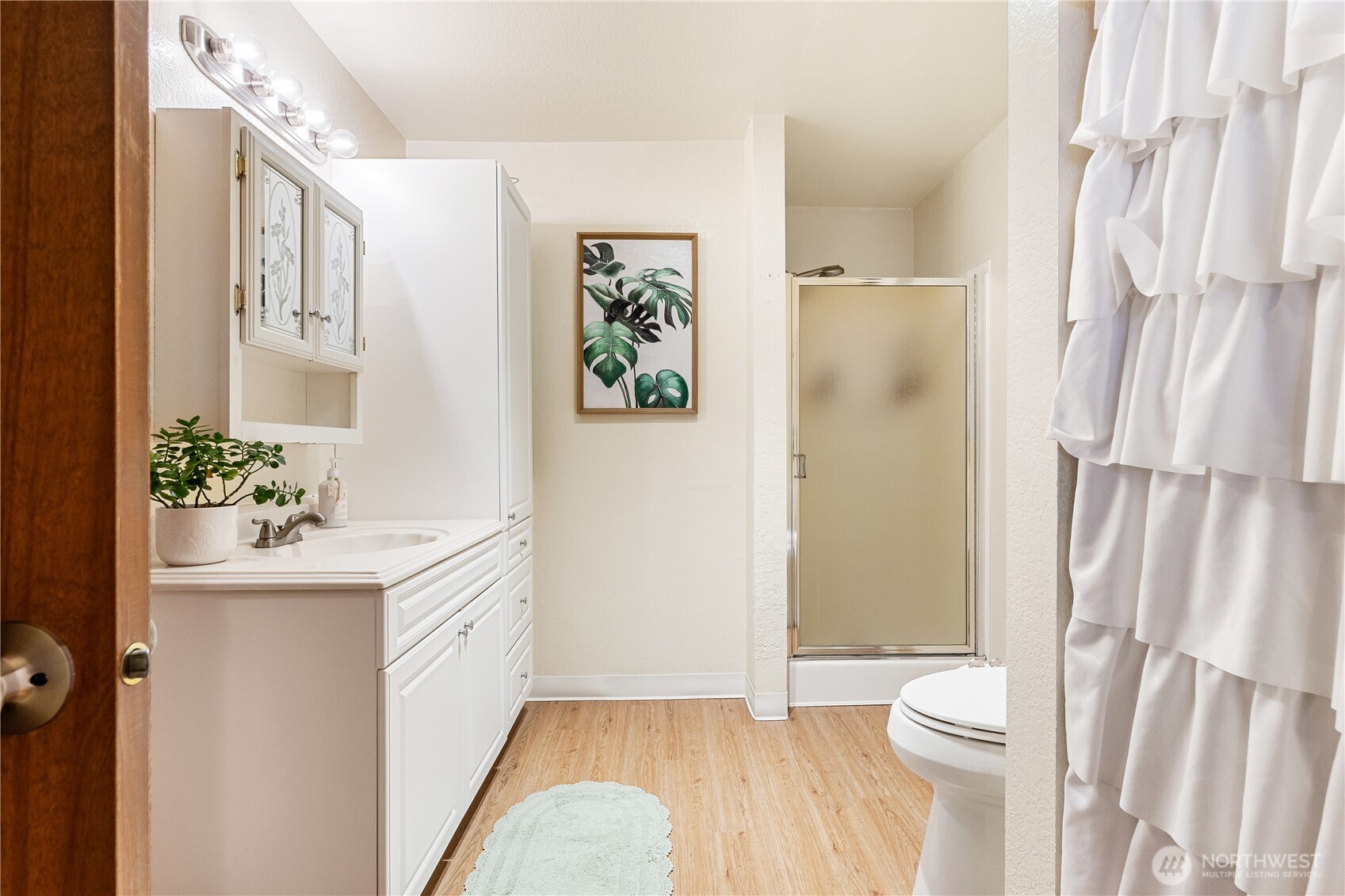 2619 Rucker Avenue, Unit 2 Everett, WA 98201 - Photo 23 of 33 a bathroom with a sink a toilet and shower