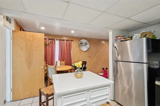 a white refrigerator freezer sitting in a kitchen