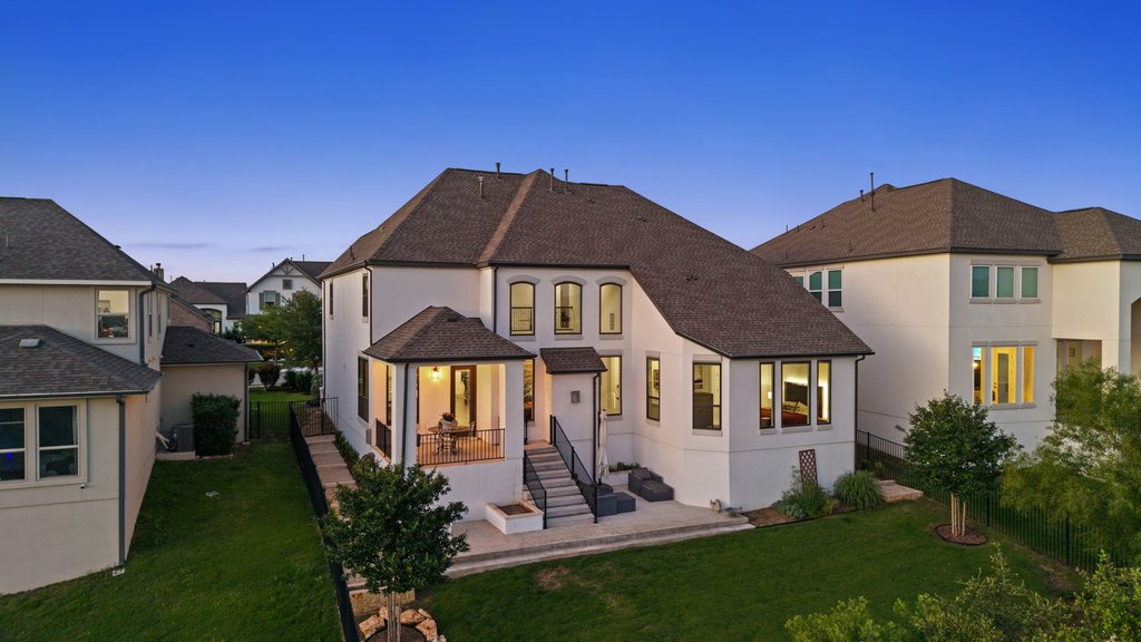 1221 Siena Sunset Road Leander, TX 78641 - Photo 39 of 39 Stucco exterior with multiple gables and a dark shingle roof