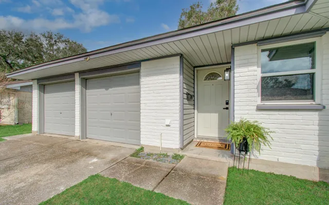 a view of house with a garage