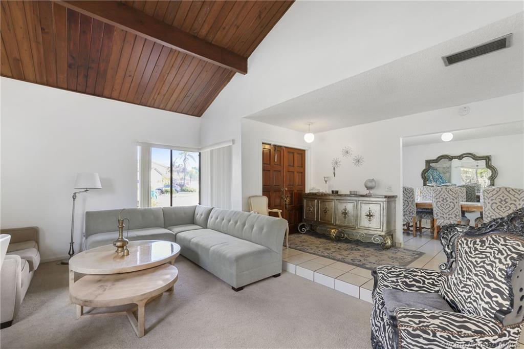 12775 Southwest 110th Terrace Miami, FL 33186 - Photo 1 of 36 a living room with furniture and a large window