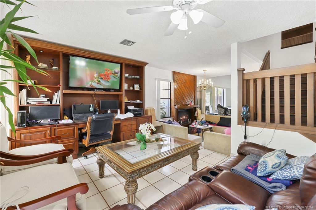 12775 Southwest 110th Terrace Miami, FL 33186 - Photo 11 of 36 a living room with furniture and a flat screen tv