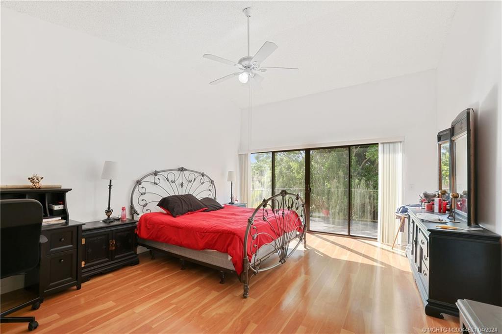12775 Southwest 110th Terrace Miami, FL 33186 - Photo 18 of 36 a living room with a bed furniture and a large window