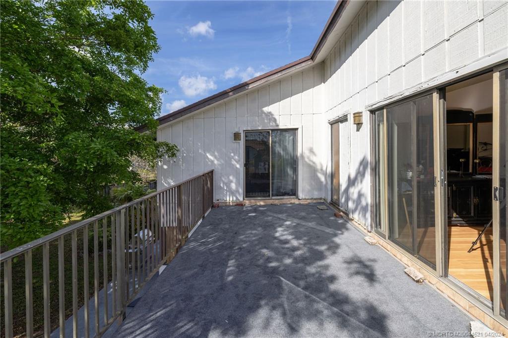 12775 Southwest 110th Terrace Miami, FL 33186 - Photo 20 of 36 a view of a house with backyard and porch