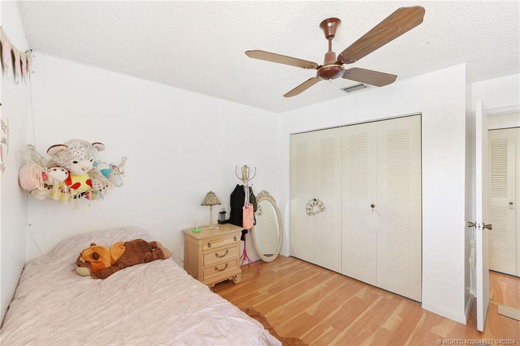 12775 Southwest 110th Terrace Miami, FL 33186 - Photo 24 of 36 a bedroom with a bed and a window