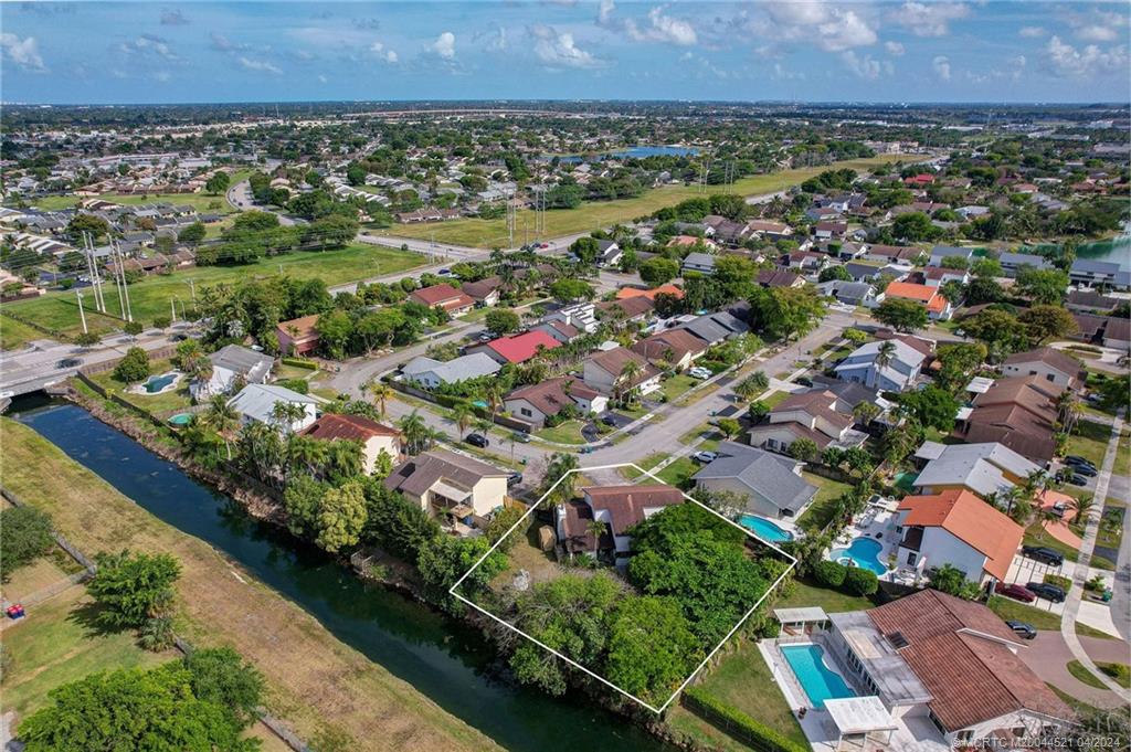 12775 Southwest 110th Terrace Miami, FL 33186 - Photo 27 of 36 an aerial view of residential houses with outdoor space and trees