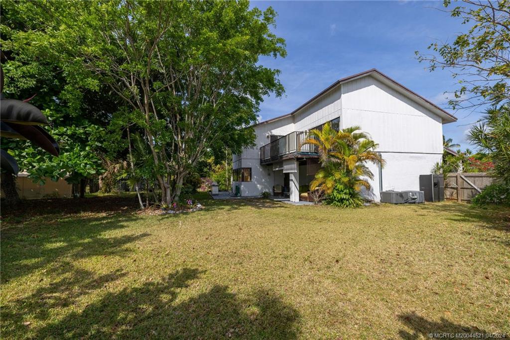 12775 Southwest 110th Terrace Miami, FL 33186 - Photo 33 of 36 a view of a house with a yard and garage