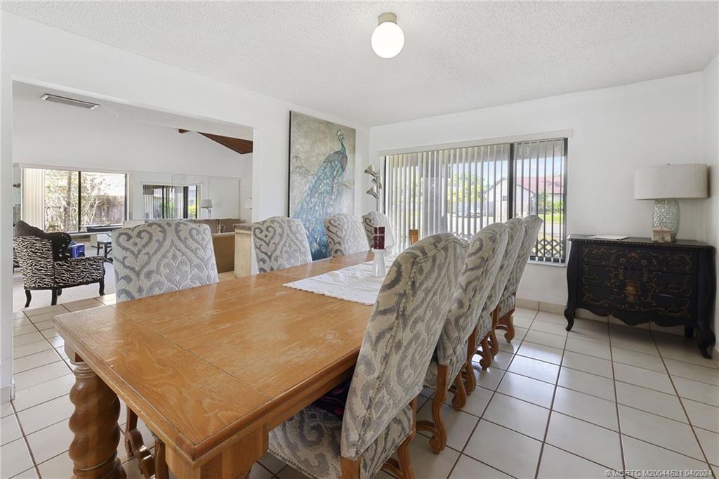12775 Southwest 110th Terrace Miami, FL 33186 - Photo 6 of 36 a view of a dining room with furniture