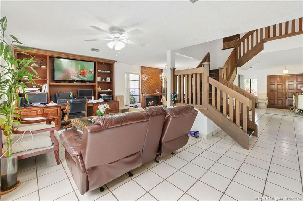 12775 Southwest 110th Terrace Miami, FL 33186 - Photo 10 of 36 a living room with furniture and a chandelier