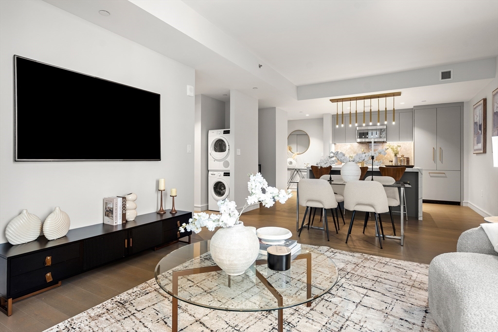 55 Lagrange Street, Unit 1901 Boston, MA 02111 - Photo 13 of 34 a living room with furniture and a flat screen tv