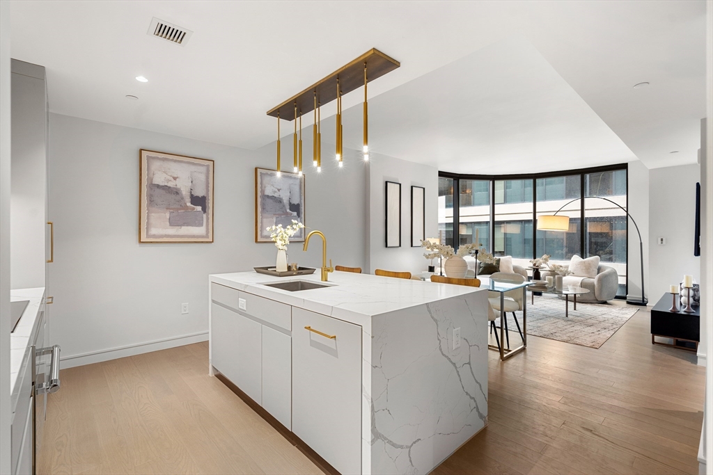 55 Lagrange Street, Unit 1901 Boston, MA 02111 - Photo 9 of 34 a view of living room with furniture and window