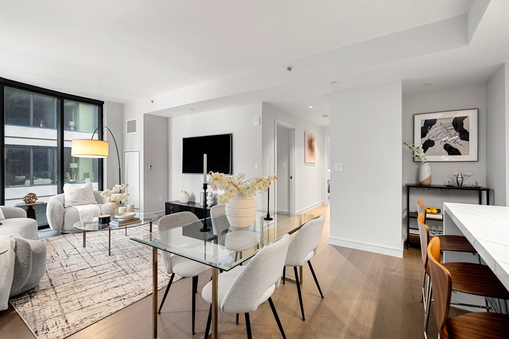 55 Lagrange Street, Unit 1901 Boston, MA 02111 - Photo 10 of 34 a living room with furniture and a flat screen tv