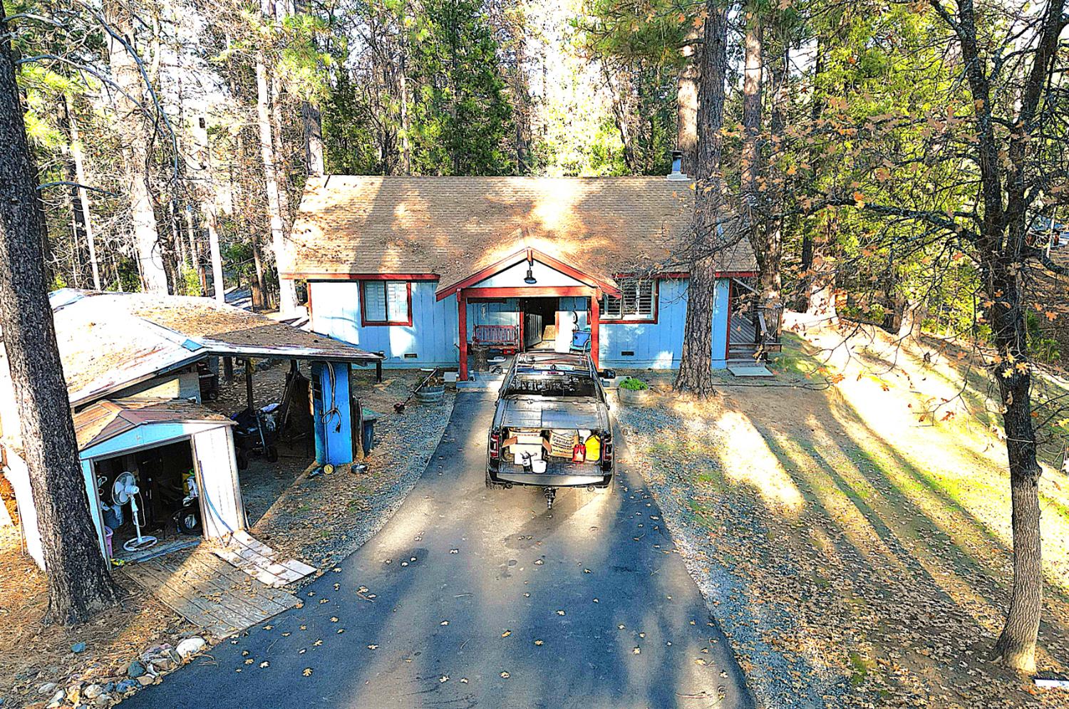 23625 Rock Hammer Road Groveland, CA 95321 - Photo 2 of 40 a car parked in front of a house