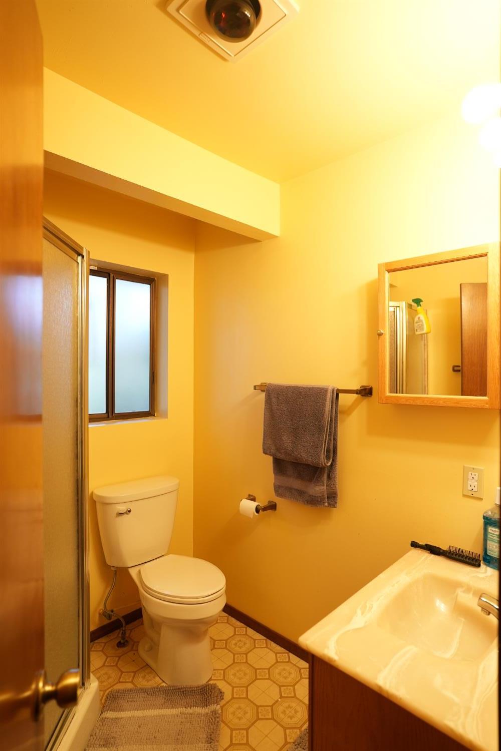 23625 Rock Hammer Road Groveland, CA 95321 - Photo 21 of 40 a bathroom with a toilet sink and mirror