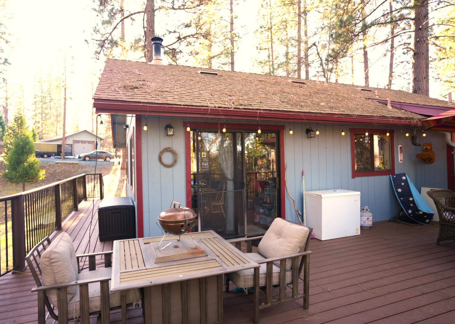 23625 Rock Hammer Road Groveland, CA 95321 - Photo 24 of 40 a view of a patio with table and chairs and potted plants