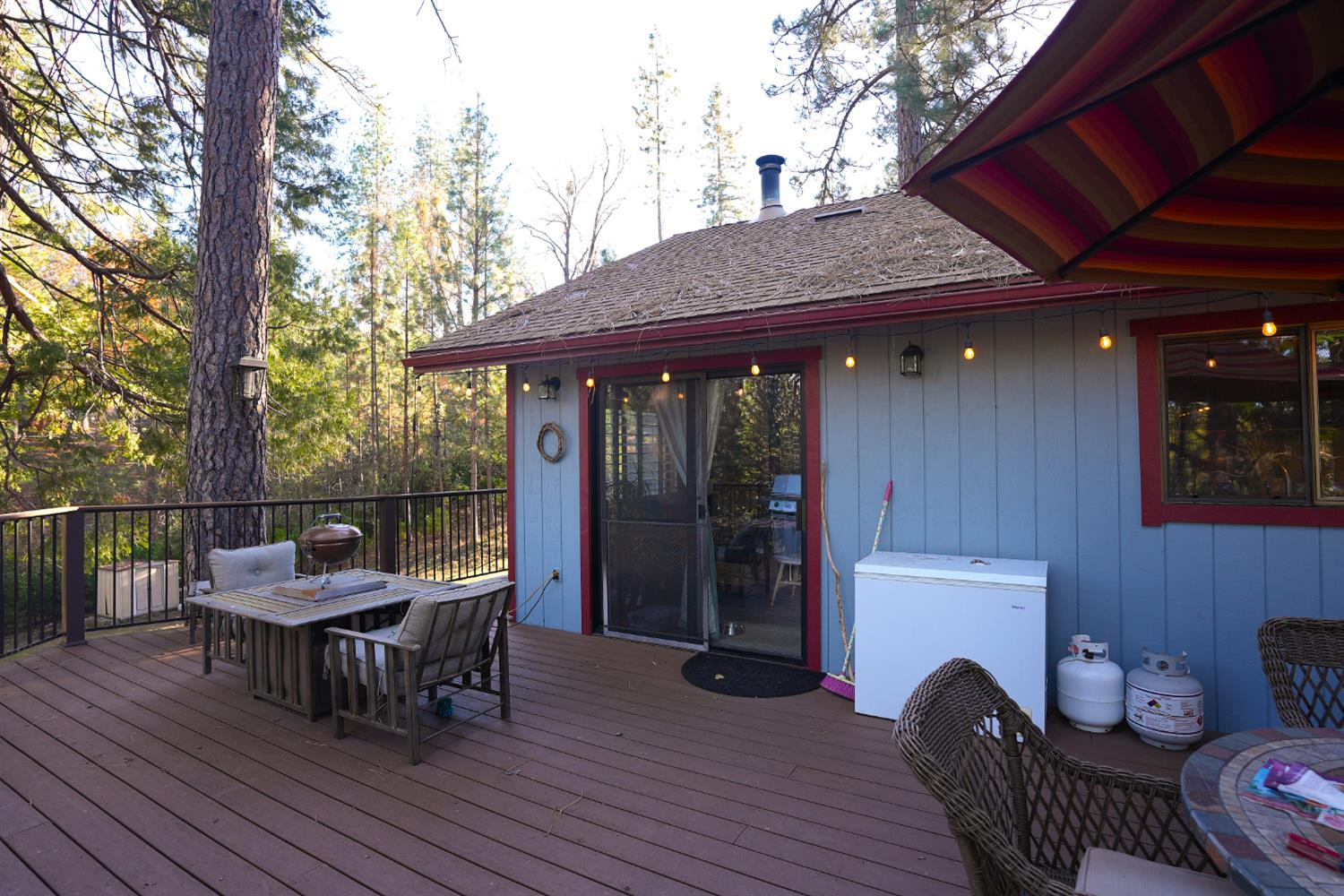 23625 Rock Hammer Road Groveland, CA 95321 - Photo 28 of 40 a view of a roof deck with table and chairs and wooden floor