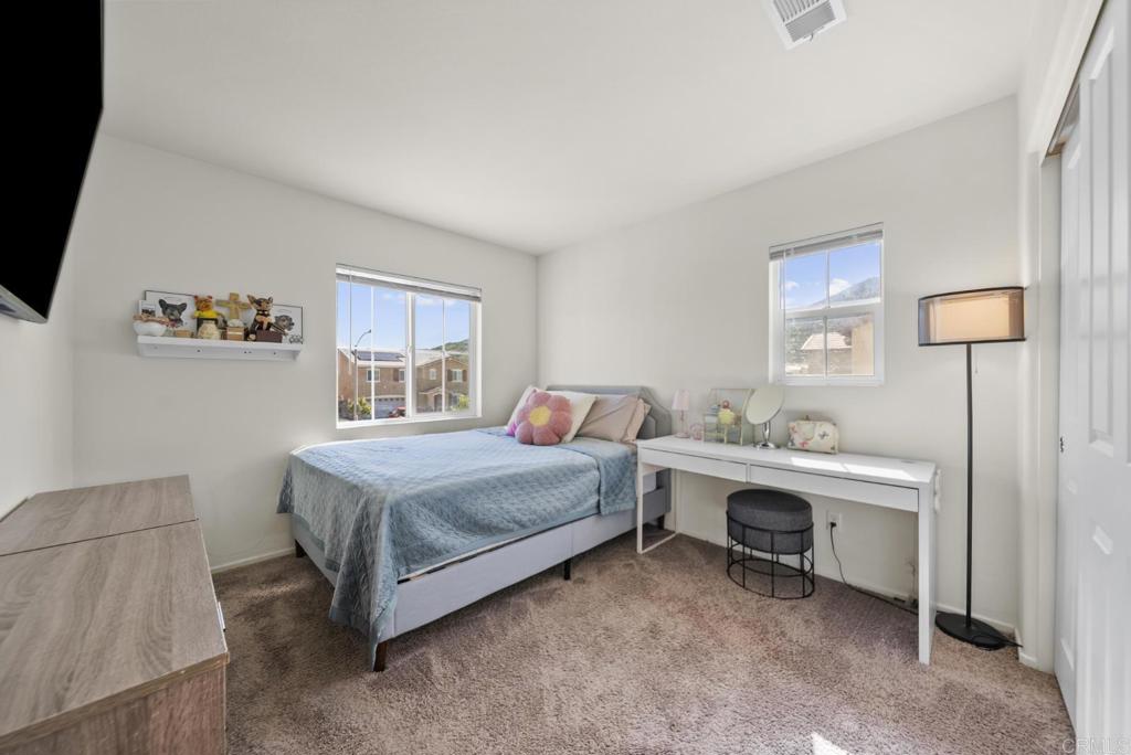 29483 Beeler Road Winchester, CA 92596 - Photo 15 of 42 a bedroom with a bed and a desk