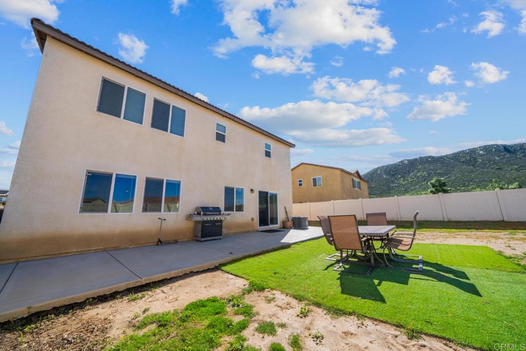29483 Beeler Road Winchester, CA 92596 - Photo 30 of 42 a backyard of a house with table and chairs