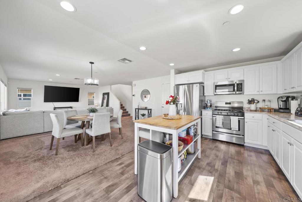 29483 Beeler Road Winchester, CA 92596 - Photo 3 of 42 a kitchen that has a lot of cabinets a sink and a stove in it