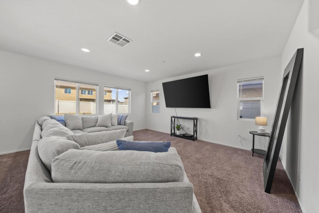 29483 Beeler Road Winchester, CA 92596 - Photo 9 of 42 a living room with furniture and a flat screen tv