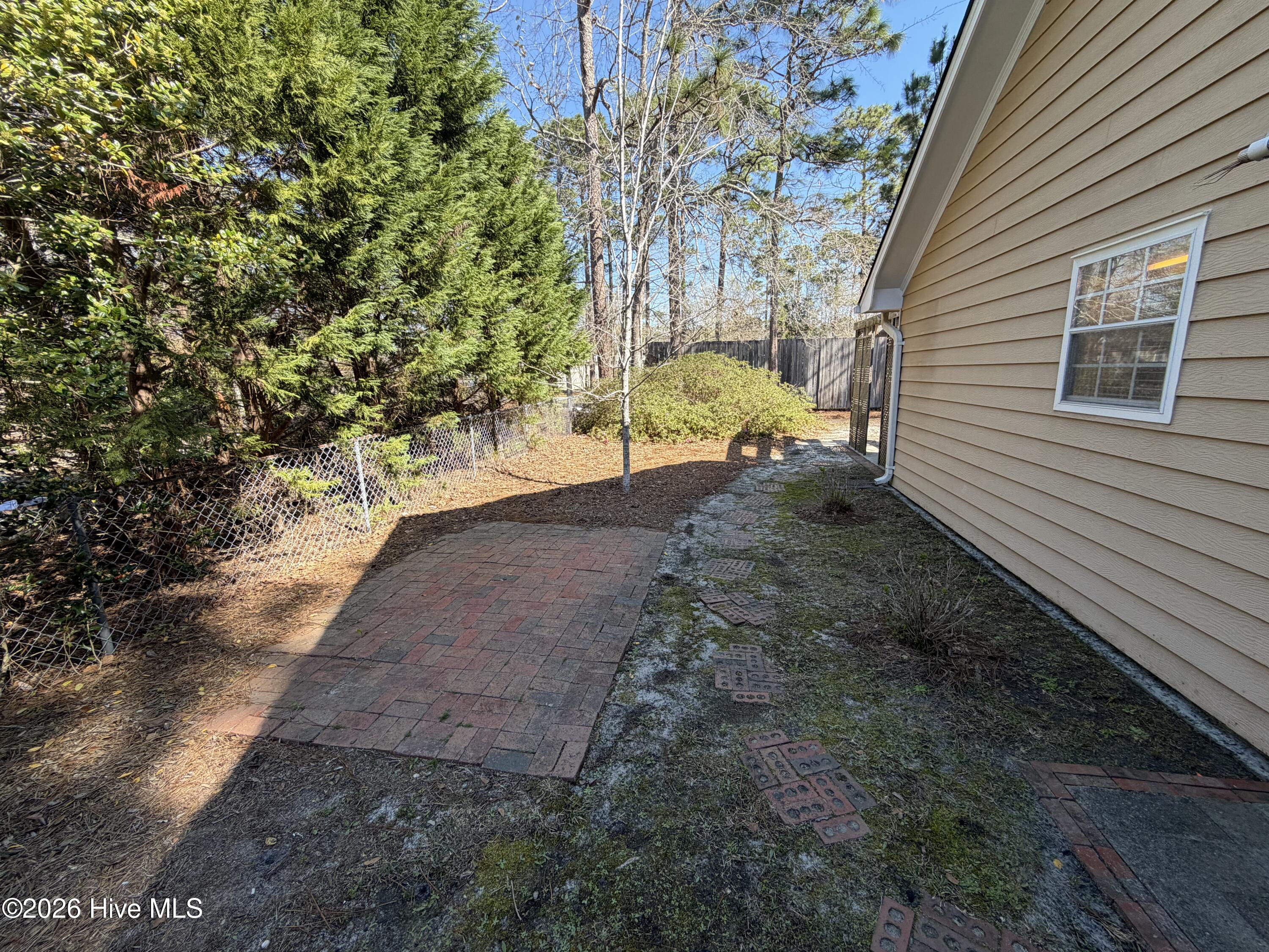 318 Hidden Valley Road Wilmington, NC 28409 - Photo 16 of 22 Left side yard