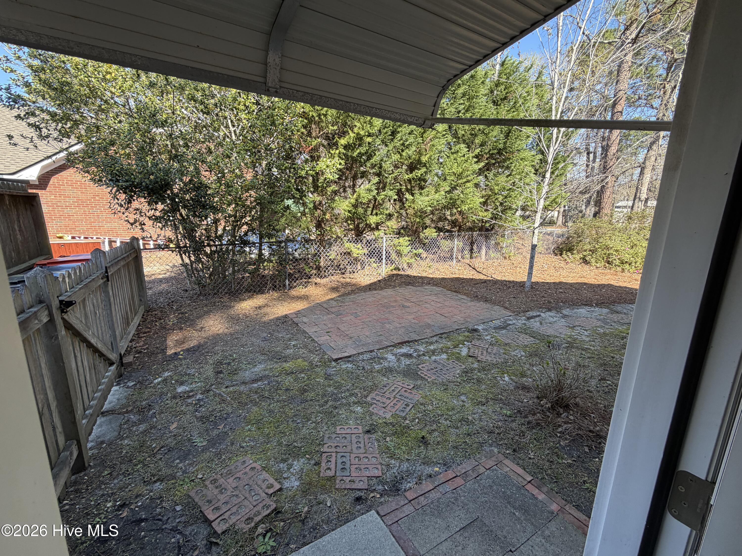318 Hidden Valley Road Wilmington, NC 28409 - Photo 2 of 22 side yard