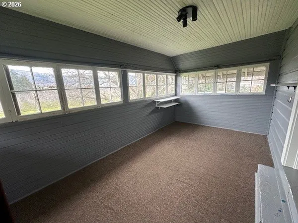an empty room with windows