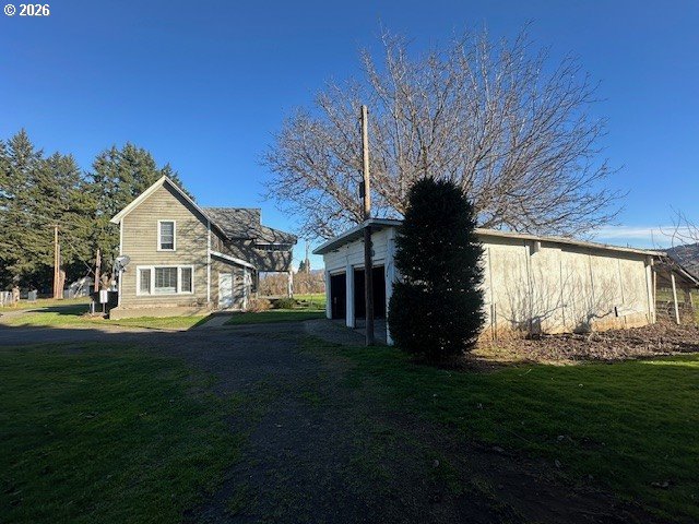 1745 Winston Road Hood River, OR 97031 - Photo 5 of 15 a front view of a house with a garden