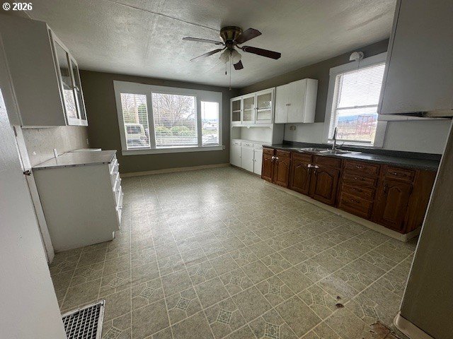 1745 Winston Road Hood River, OR 97031 - Photo 8 of 15 a kitchen with granite countertop a refrigerator a sink a stove a microwave and island