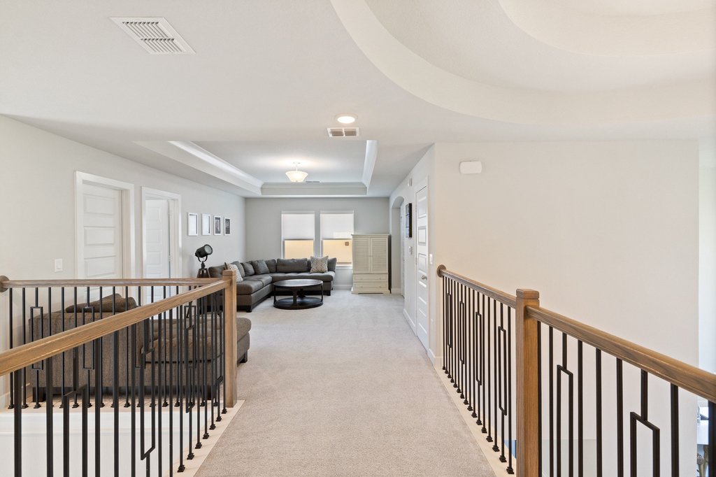 741 Rawson Bend Austin, TX 78738 - Photo 24 of 40 The second floor hallway overlooks the living room and entry foyer below making it easy to stay connected between floors.