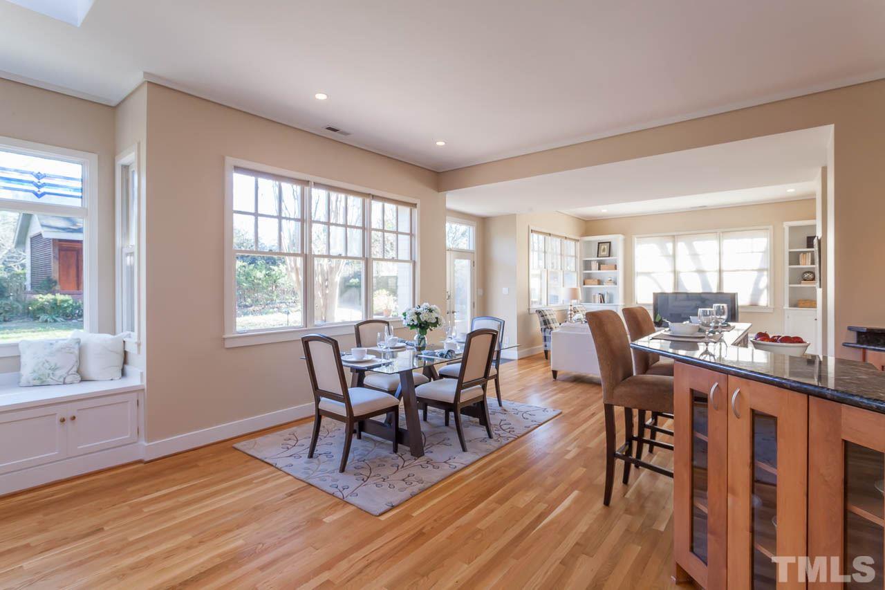 304 Hillcrest Road Raleigh, NC 27605 - Photo 3 of 22 a view of a dining room with furniture and wooden floor