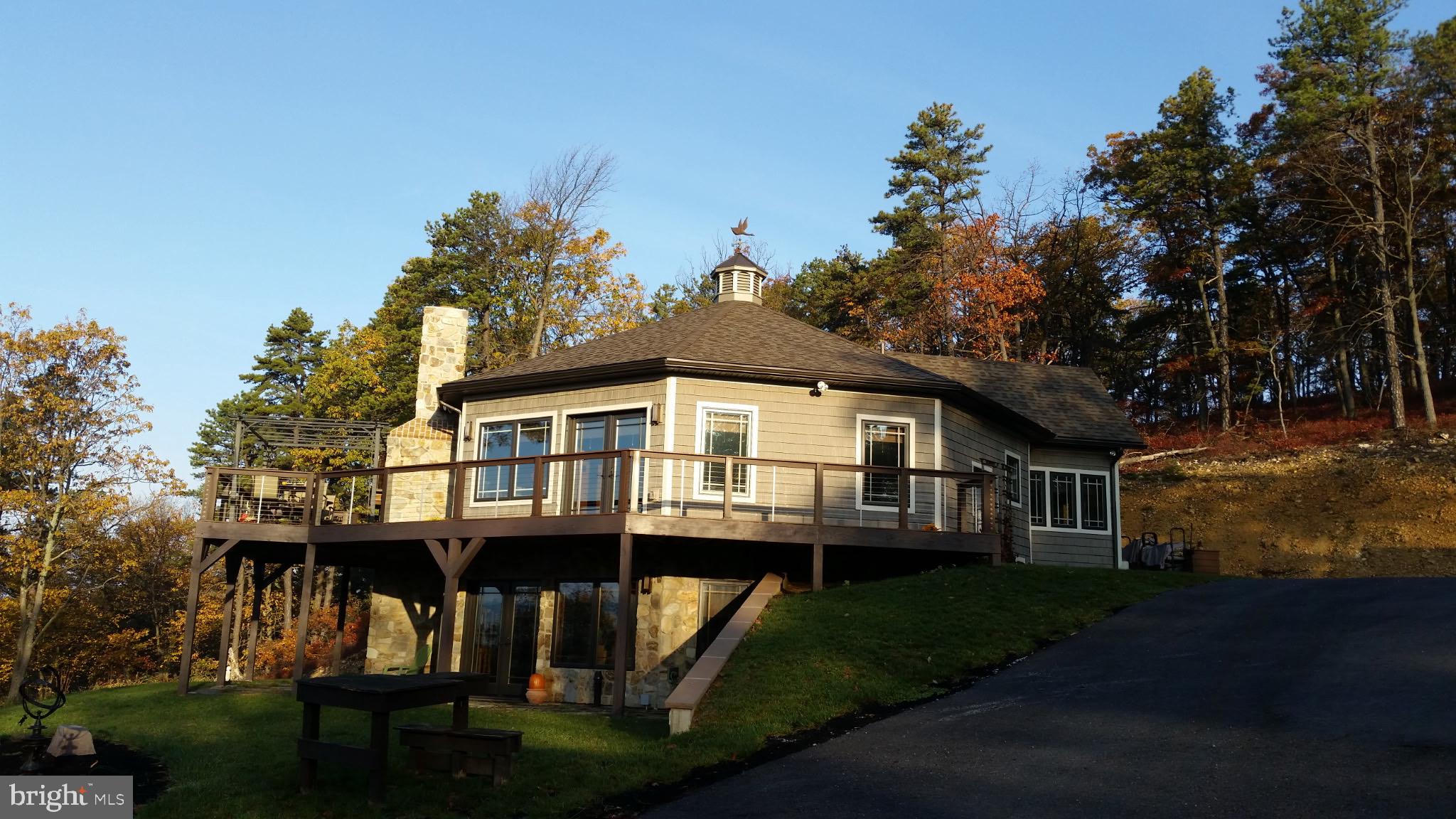 729 High Mountain Road Gardners, PA 17324 - Photo 1 of 15 a front view of a house with a garden