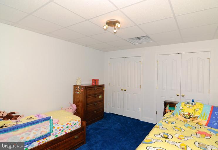 14441 Black Ankle Road Mount Airy, MD 21771 - Photo 2 of 25 a bedroom with a bed and wooden floor
