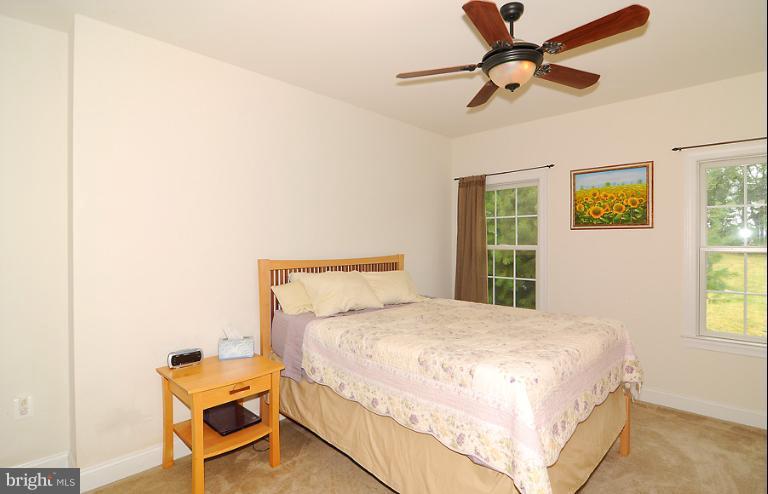 14441 Black Ankle Road Mount Airy, MD 21771 - Photo 16 of 25 a bedroom with a bed and a window