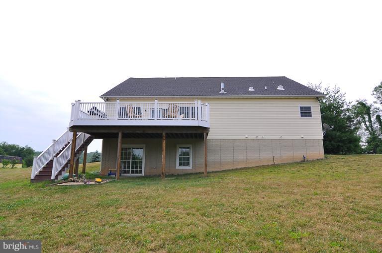 14441 Black Ankle Road Mount Airy, MD 21771 - Photo 3 of 25 a front view of a house with a garden