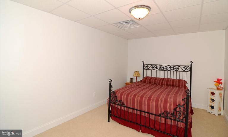 14441 Black Ankle Road Mount Airy, MD 21771 - Photo 4 of 25 a bedroom with a bed and a window