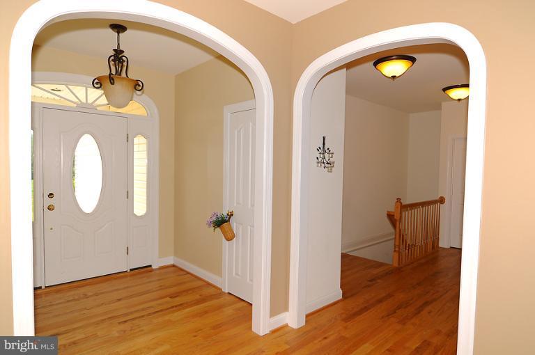 14441 Black Ankle Road Mount Airy, MD 21771 - Photo 7 of 25 a view of a hallway with wooden floor
