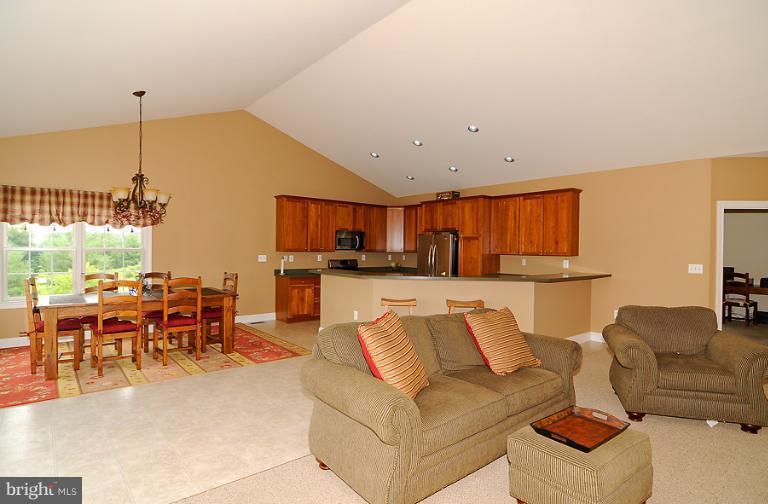 14441 Black Ankle Road Mount Airy, MD 21771 - Photo 9 of 25 a living room with furniture kitchen view and a wooden floor