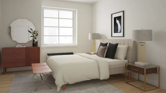 a bedroom with a bed a table and a window