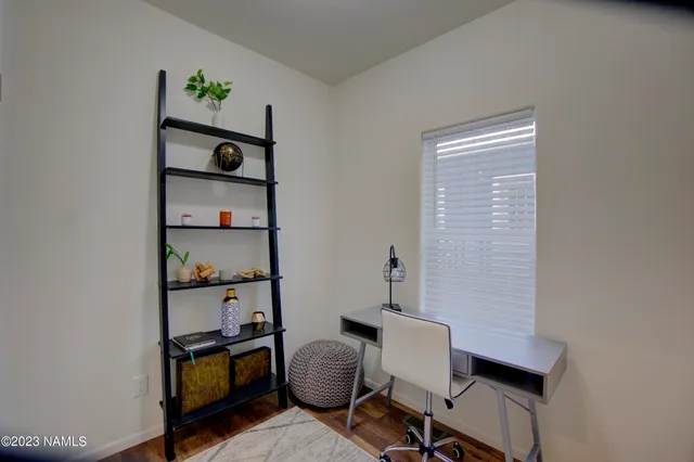 a bathroom with a granite countertop sink toilet a mirror and bathtub